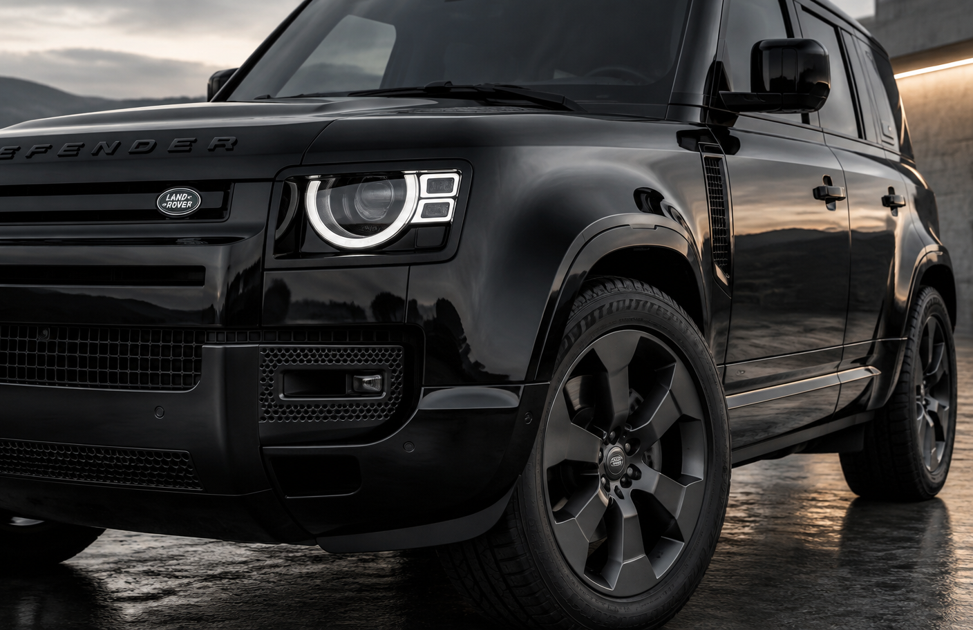 Black Land Rover Defender wheel and headlight detail