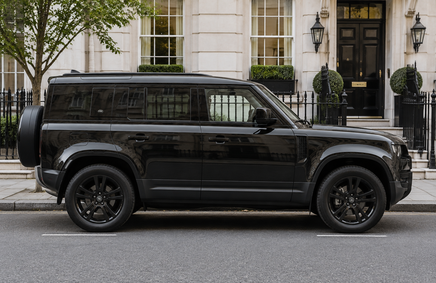 Black Land Rover Defender full side profile in London